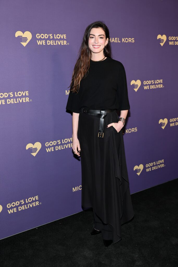 Anne Hathaway stunned in a floor-length gown, combining classic elegance with contemporary detailing.