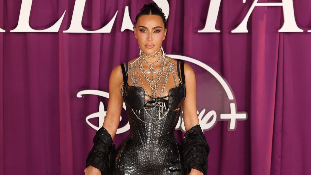 Kim Kardashian smolders in black leather corset dress